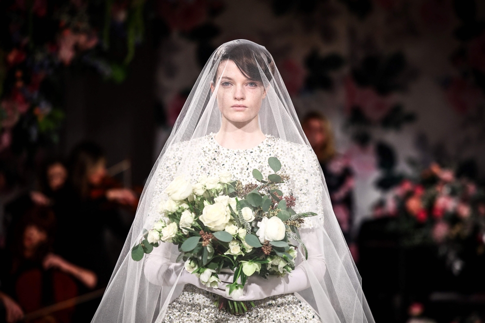 A model presents a creation by British designer Richard Quinn during the catwalk presentation for his Autumn/Winter 2024 collection during London Fashion Week in London on February 17, 2024. (Photo by HENRY NICHOLLS / AFP)

