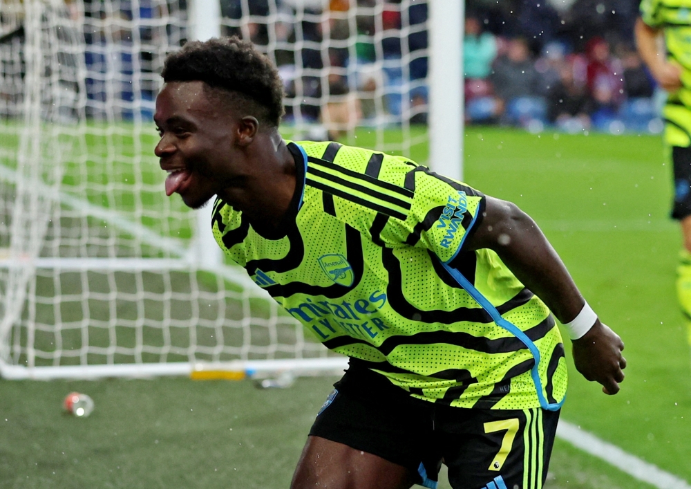 Arsenal's Bukayo Saka celebrates scoring their third goal.— REUTERS