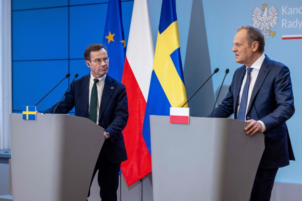 Polish Prime Minister Donald Tusk (R) and Swedish Prime Minister Ulf Kristersson address a joint press conference after their meeting in Warsaw, Poland. — AFP 