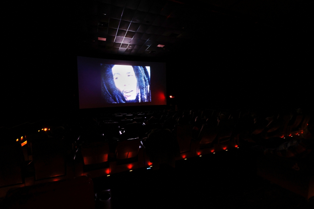 An image of Bob Marley is projected on a cinema screen as moviegoers watch the ending to the "Bob Marley: One Love" film in Glen Cove, New York, U.S., February 17, 2024. REUTERS/Shannon Stapleton
