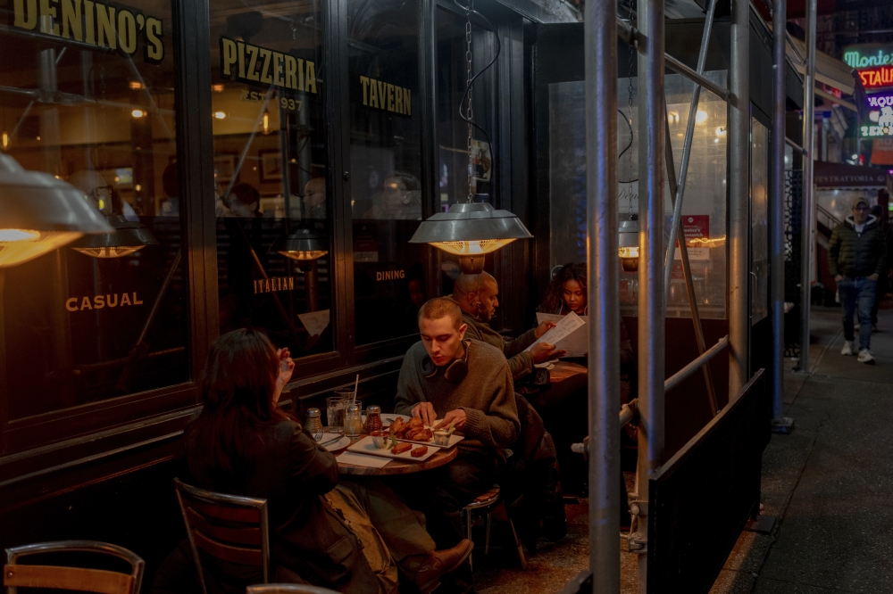 People dine at a restaurant in the West Village neighborhood in Manhattan, Jan. 27, 2024-The New York Times)