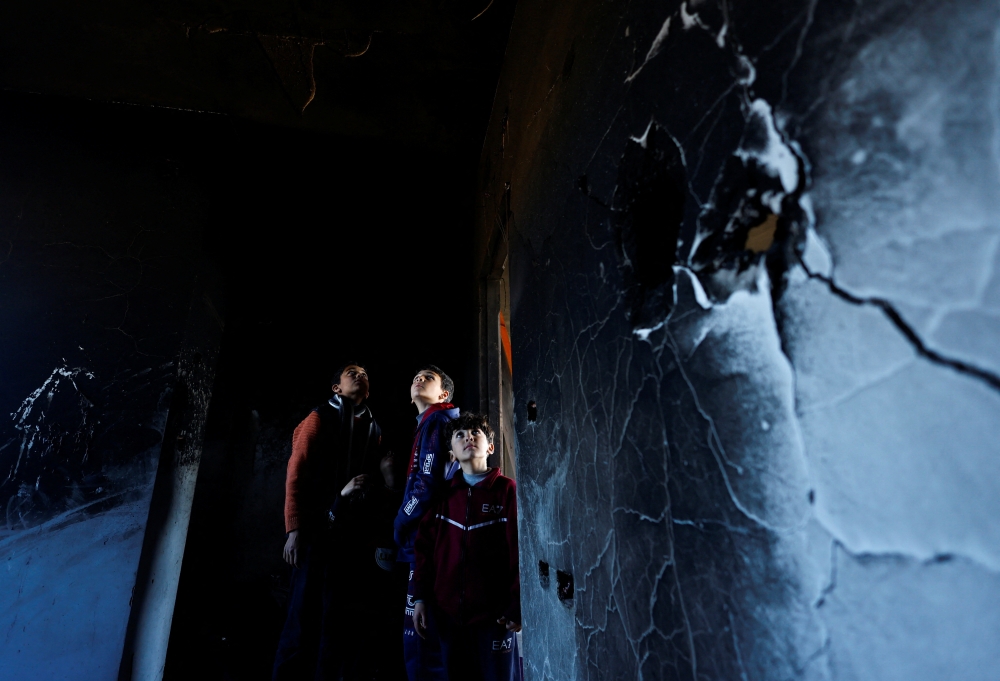 Palestinian children inspect the site of an Israeli strike on a shelter belonging to Doctors Without Borders (MSF) in Khan Younis in southern Gaza Strip, on Wednesday. - Reuters