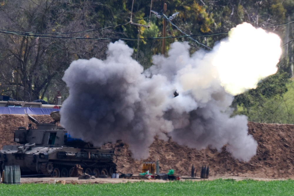 An artillery unit fires towards Gaza, amid the ongoing conflict between Israel and the Palestinian Islamist group Hamas, in Israel, February 22, 2024.