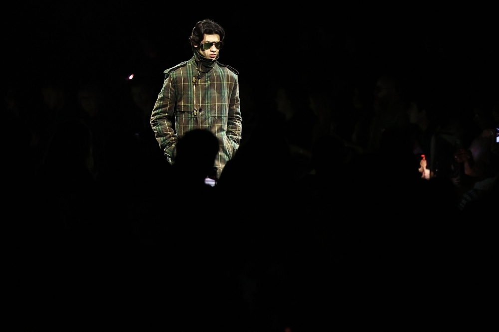A model presents a creation during a catwalk presentation for British fashion house Burberry's Autumn/Winter 2024 collection, at London Fashion Week 

