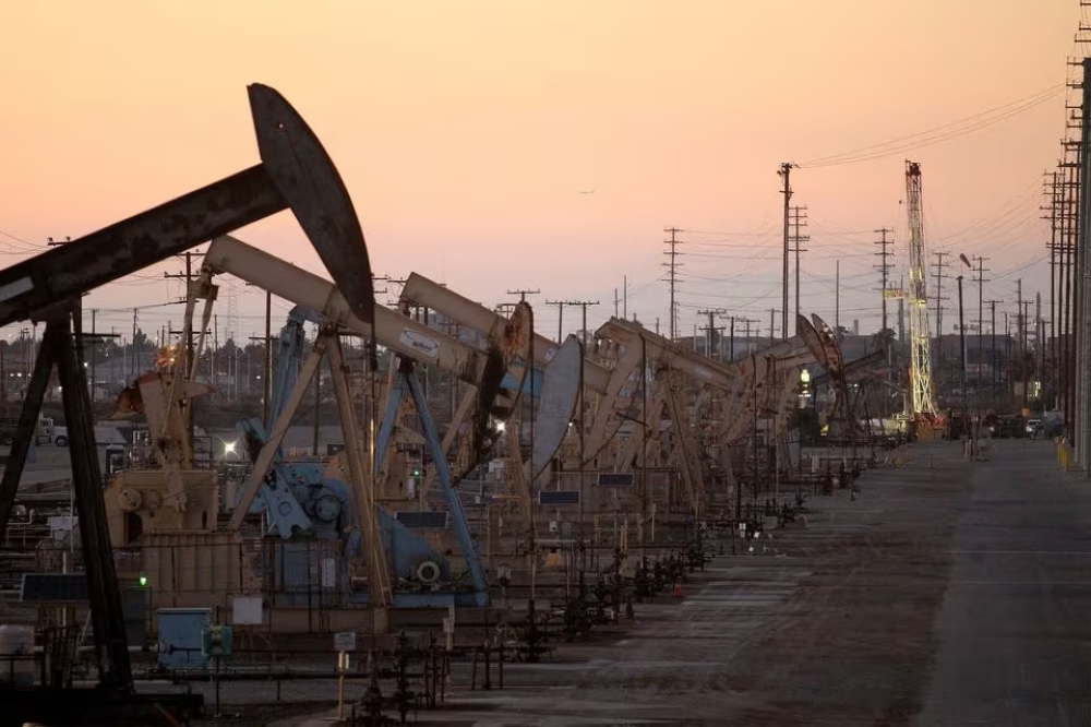 Oil rig pumpjacks, known as 'thirsty birds,' extract crude from Wilmington Field near Long Beach, California.