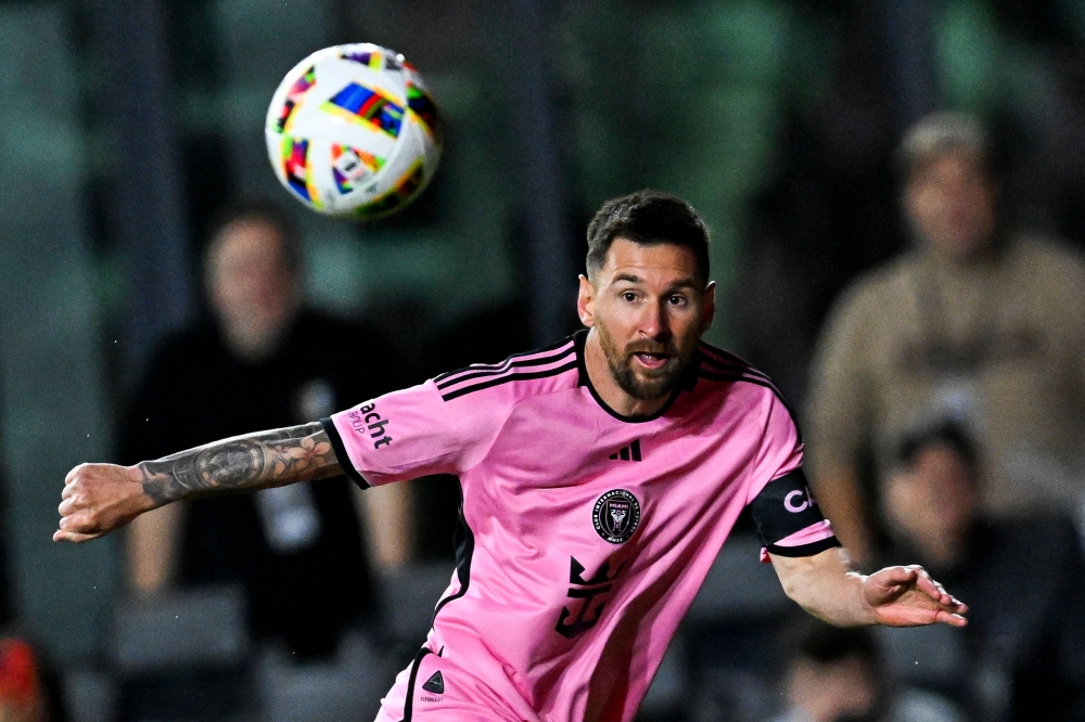 Inter Miami's Argentine forward #10 Lionel Messi eyes the ball during the MLS football match between Inter Miami and Real Salt Lake at Chase Stadium 