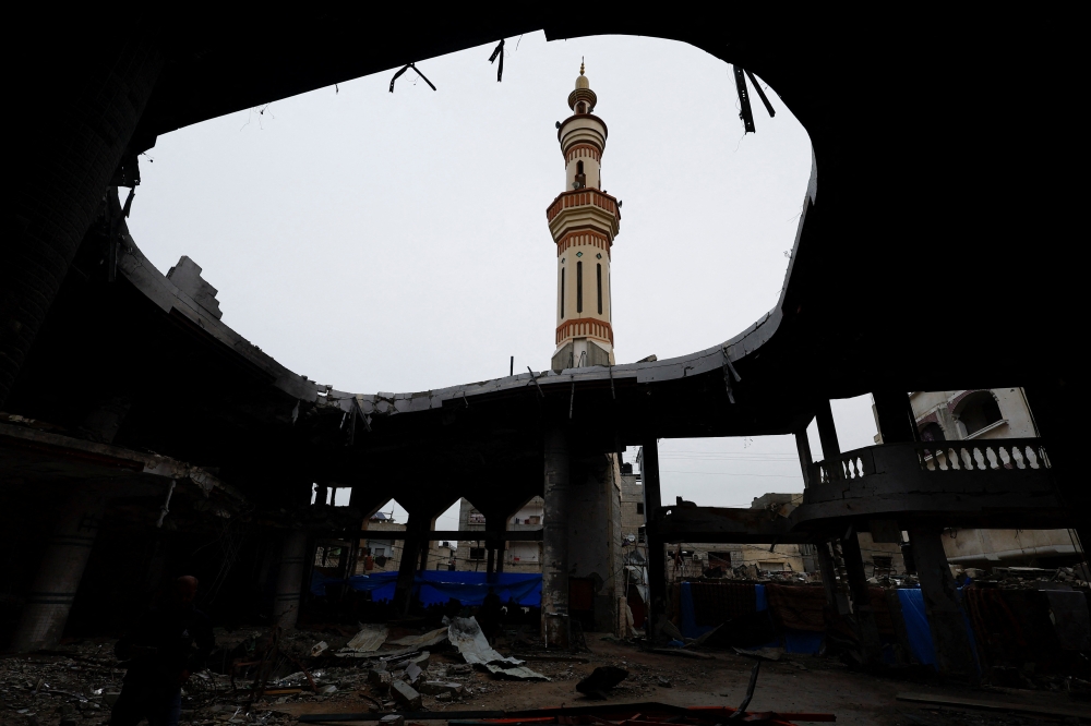 A minaret is seen at the ruins of a mosque destroyed in Israeli strikes in Rafah in the southern Gaza Strip. - Reuters 
