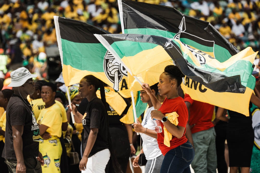 Supporters display African National Congress (ANC) flags during the Election Manifesto launch at the Moses Mabhida Stadium in Durban. — AFP 