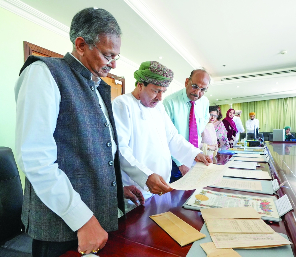 Dr Hamad Mohammed al Dhawyani, Chairman of NRAA, sees documents handed over by his Indian counterpart Arun Singal