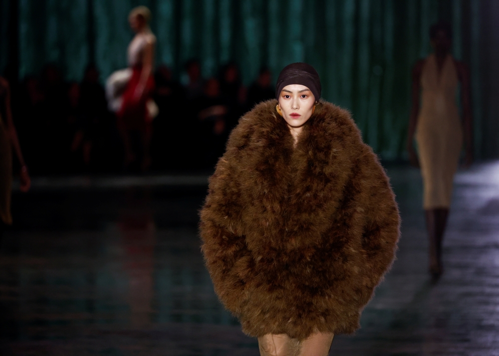 A model presents a creation by designer Anthony Vaccarello as part of his Fall-Winter 2024/2025 Women's ready-to-wear collection show for fashion house Saint Laurent during Paris Fashion Week, in Paris, France, February 27, 2024. REUTERS/Gonzalo Fuentes
