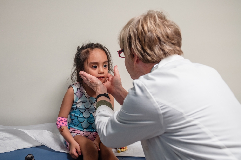 Dr. Jane C. Burns, director of the Kawasaki Disease Research Center at the University of California, San Diego, examines Inez Maldonado Diega 