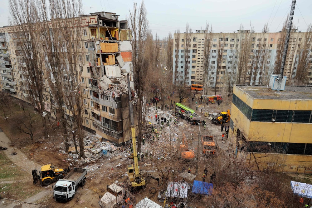 Rescuers work at the site of a heavily damaged multi-story apartment building, following a Russian drone attack, in Odesa. — AFP 