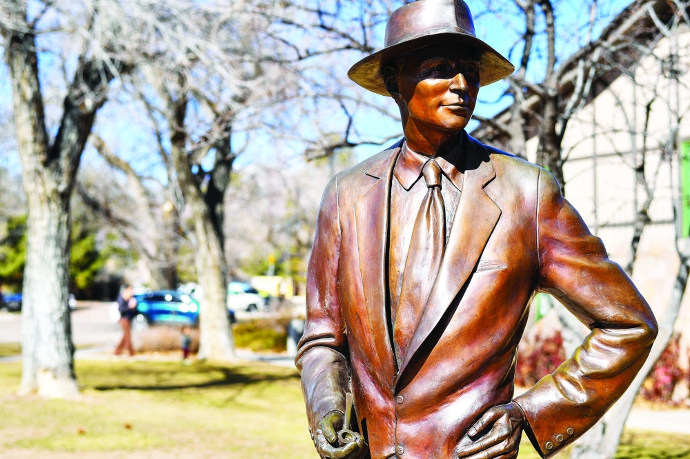 View of the statue of J. Robert Oppenheimer in the park next to the Fuller Lodge, in Manhattan Project National Historical Park, in Los Alamos, New Mexico, on February 20, 2024. Christopher Nolan's $1 billion-grossing "Oppenheimer" hasn't just lined the pockets of Hollywood studio executives -- it has also brought an unexpected windfall to the secretive community of Los Alamos.
The movie, the clear frontrunner to win best picture at the Oscars on March 10, tells the story of the invention of the atomic bomb.
Much of the action takes place in Los Alamos, a town built around a top-secret lab that was created from scratch in New Mexico at the suggestion of physicist J. Robert Oppenheimer, who had a lifelong passion for the surrounding mountains.