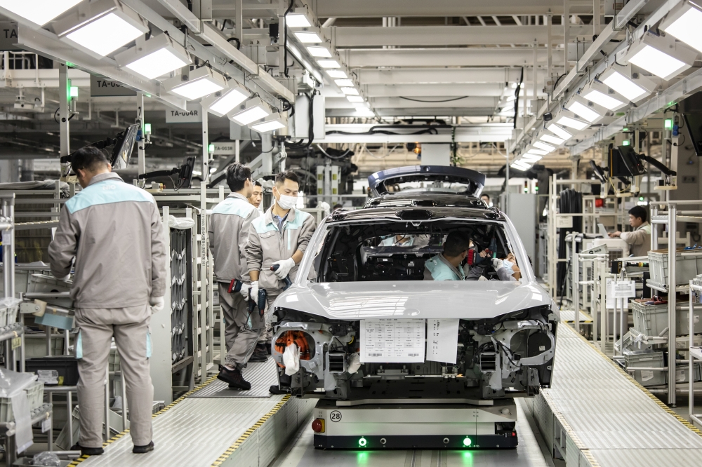 Workers on Nio’s vehicle assembly line in Hefei, China. — The New York Times