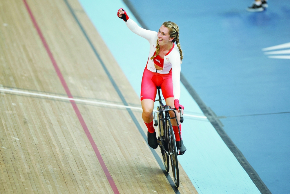 England's Laura Kenny celebrates after winning gold in the women's 10 km scratch race.— REUTERS