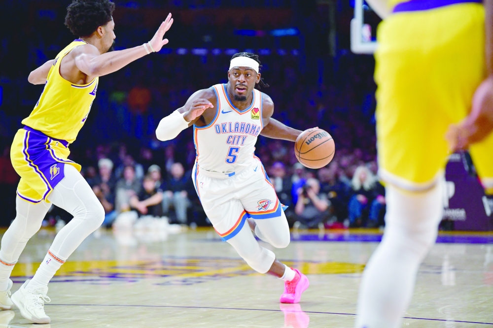 Luguentz Dort (5) moves to the basket against Spencer Dinwiddie (26).— USA TODAY Sports
