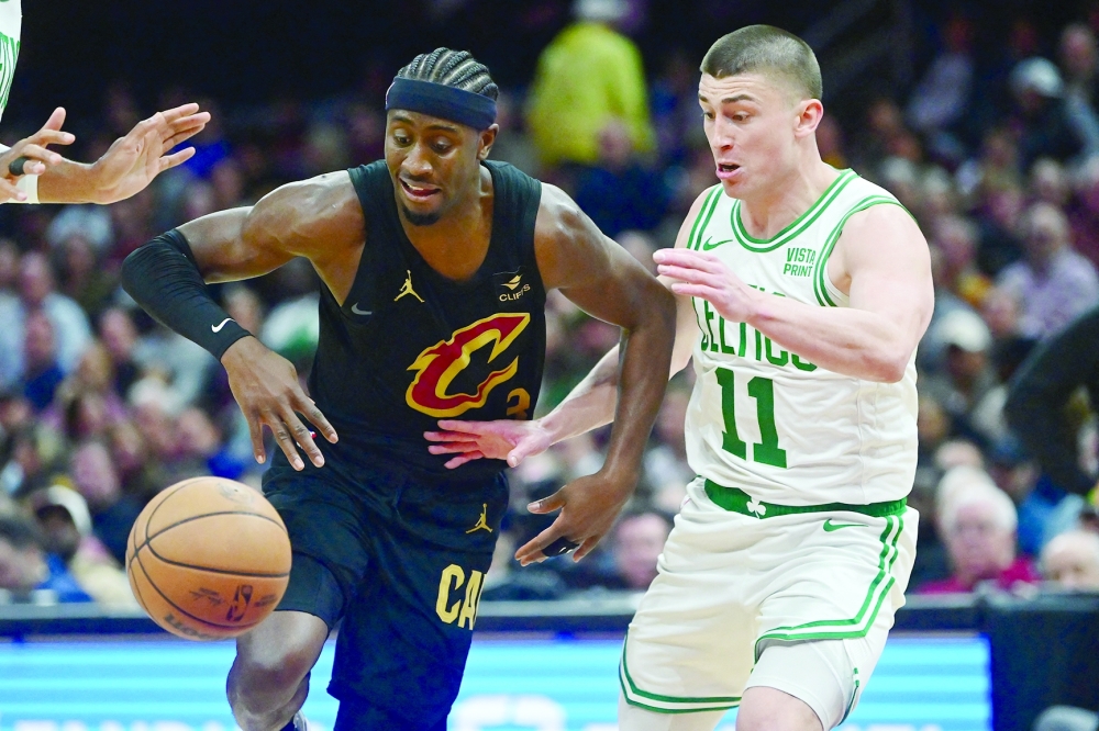 Cleveland Cavaliers guard Caris LeVert (3) drives to the basket against Boston Celtics guard Payton Pritchard (11) during the second half at Rocket Mortgage FieldHouse -- USA TODAY Sports
