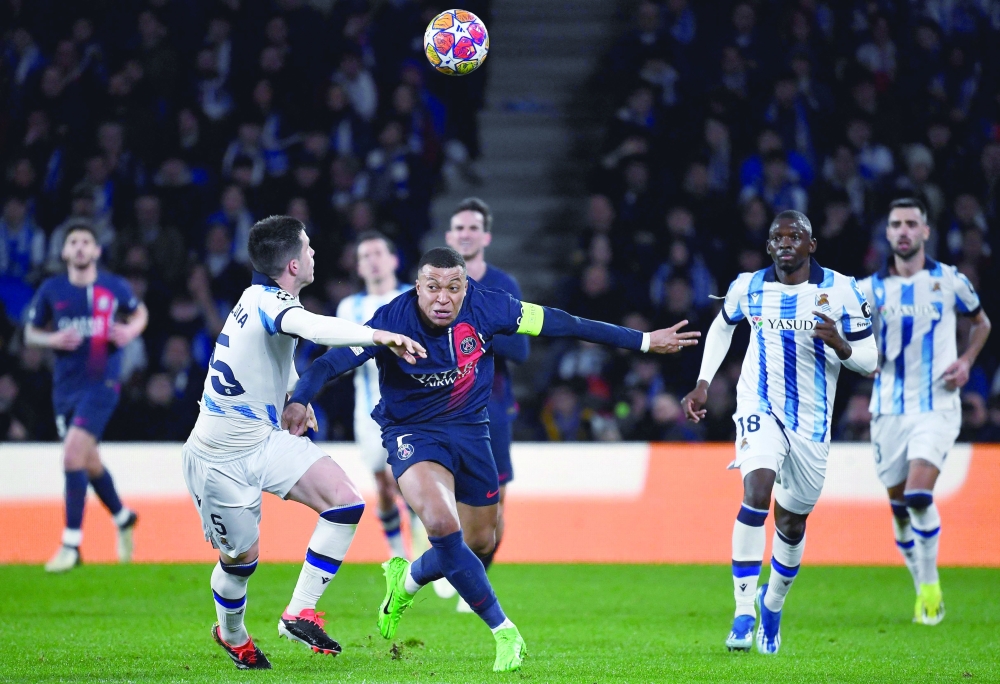 French forward #07 Kylian Mbappe vies with Real Sociedad's Spanish midfielder #05 Igor Zubeldia during the UEFA Champions League -- AFP