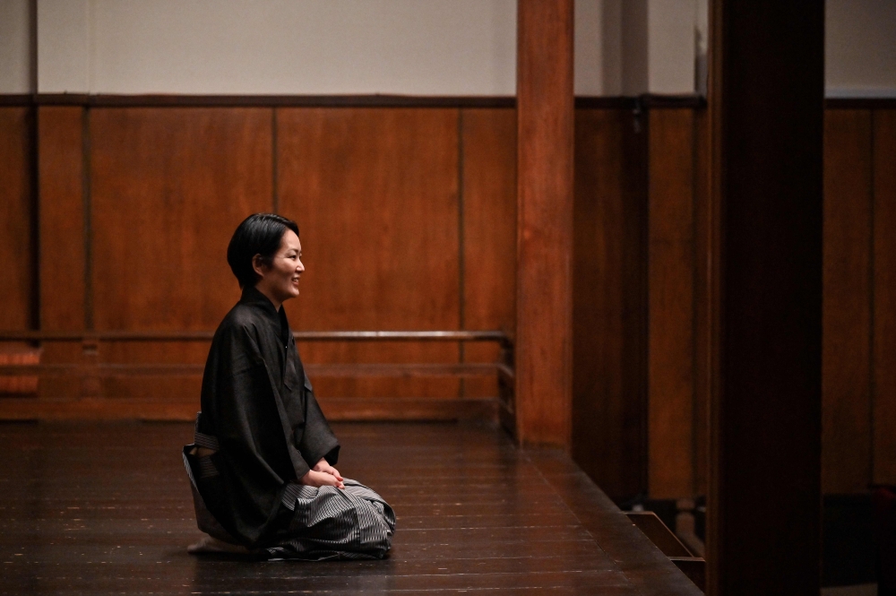 This photo taken on January 24, 2024 shows Mayuko Kashiwazaki speaking during an interview with AFP following a rehearsal for the principle role in "Dojoji", a famous Japanese traditional Noh drama about the revenge of a betrayed woman, at a theatre in Tokyo. Noh, with its elaborate layered costumes and hand-crafted masks, is one of the most ancient surviving forms of theatre, with origins dating back to the eighth century. - TO GO WITH 8March-women-Japan-culture-theatre,FOCUS by Mathias CENA
 (Photo by Richard A. Brooks / AFP) / TO GO WITH 8March-women-Japan-culture-theatre,FOCUS by Mathias CENA

