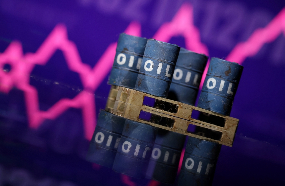Illustration shows miniatures of oil barrels and rising stock graph REUTERS