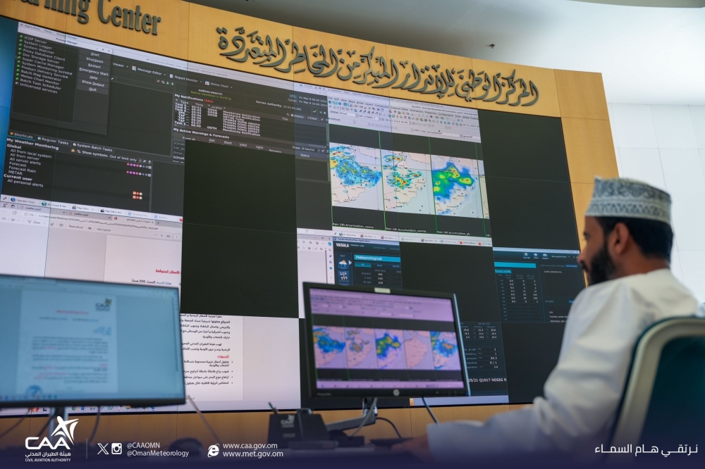 An official track the progress of low pressure at the National Multi Hazard Early Warning Centre in Muscat on Friday.  