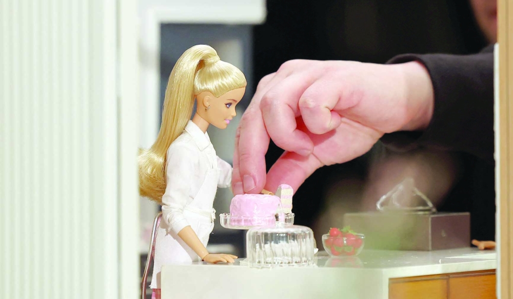 A stop motion specialist adjusts a Barbie doll on a set at Mattel Design Center in El Segundo, California, U.S., February 22, 2024.