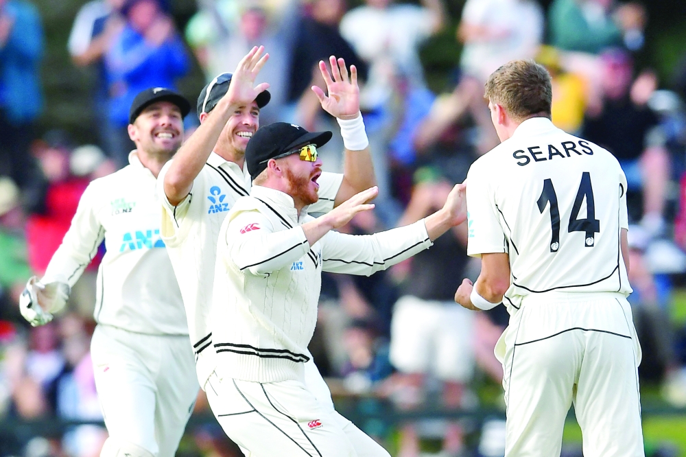 New Zealand's Ben Sears (R) celebrates with teammates.— AFP