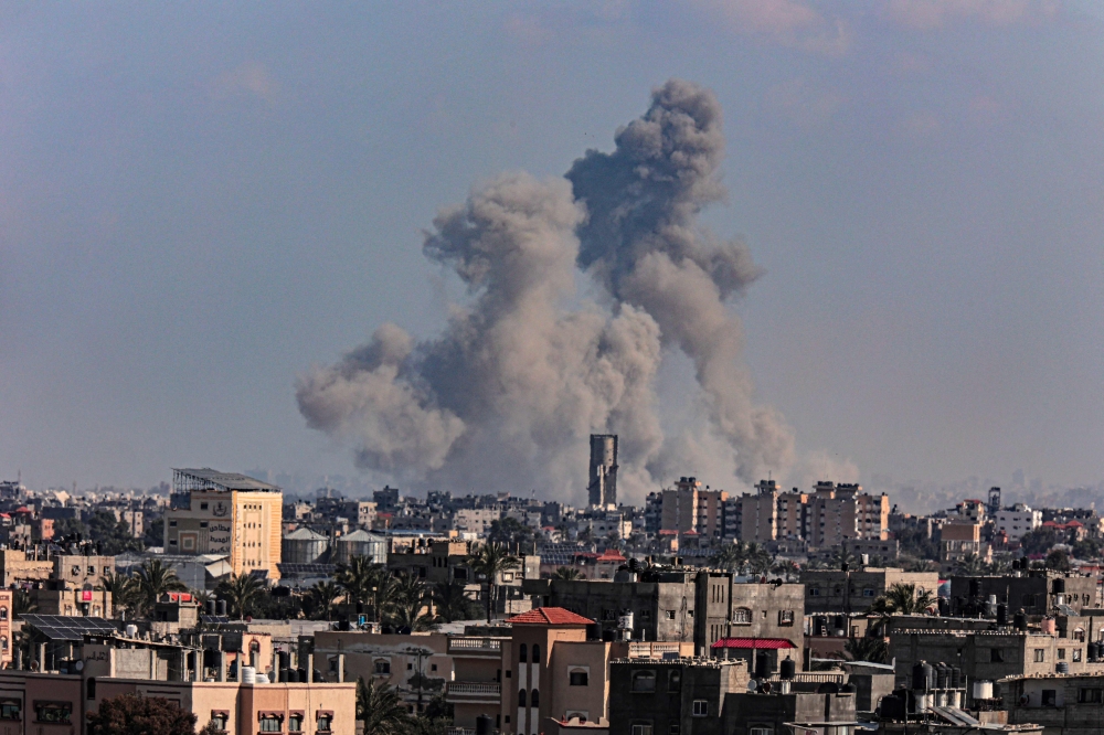 A picture shows smoke billowing over Khan Yunis during Israeli bombardment. — AFP 