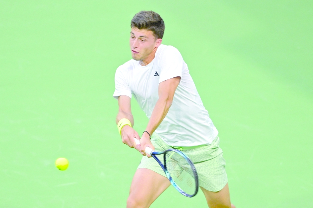 Luca Nardi (ITA) hits a shot as he defeats Novak Djokovic (SRB).— USA TODAY Sports
