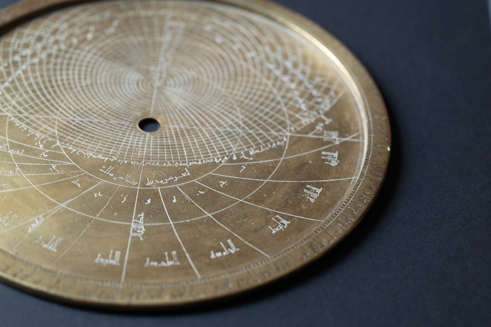 A brass astrolabe, an ancient device used to map the heavens, with Arabic inscriptions, Hebrew markings and Western numerals, at the Fondazione Museo Miniscalchi-Erizzo, a museum in Verona, Italy, March 7, 2024. (Clara Vannucci/The New York Times)