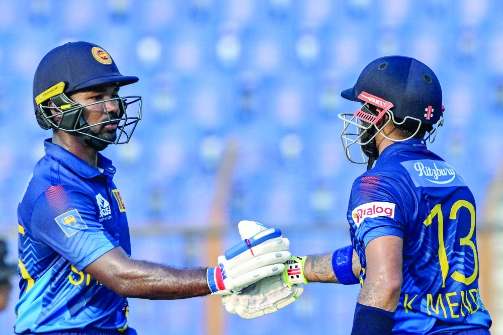 Kusal Mendis celebrates with teammate Janith Liyanage (L).— AFP


