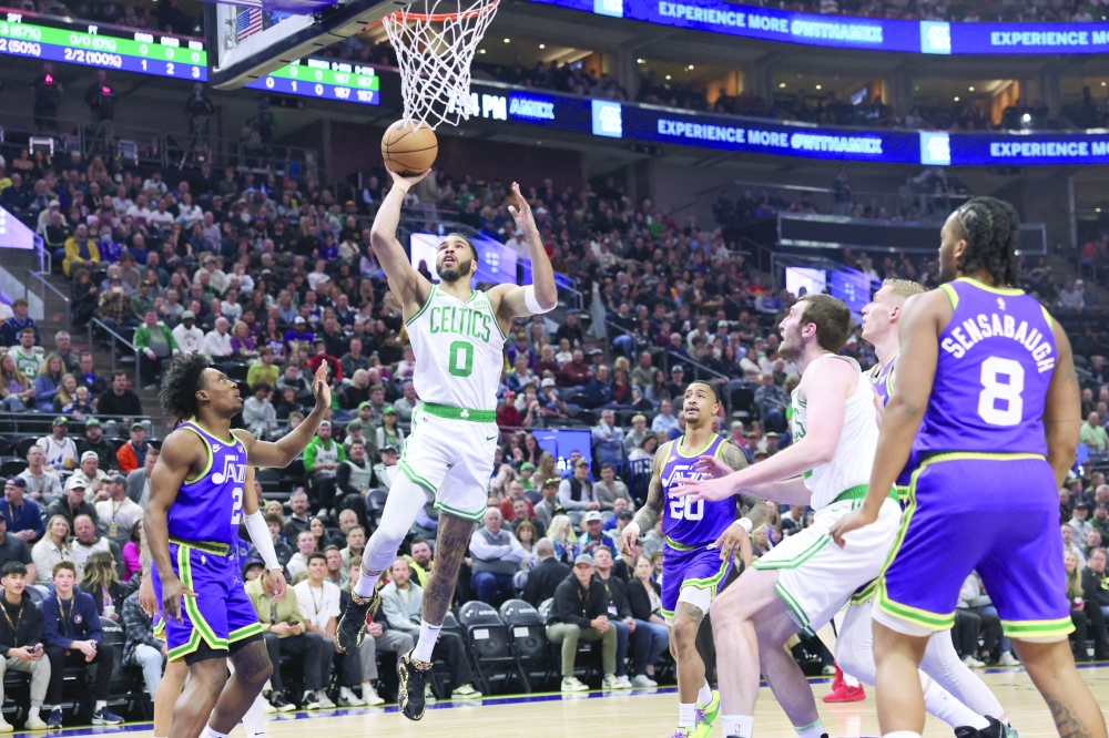 Jayson Tatum (0) lays the ball up against the Utah Jazz.— USA TODAY Sports

