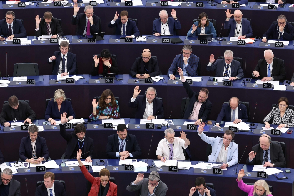 Members of the European Parliament take part in a voting session during a plenary session at the European Parliament in Strasbourg, eastern France. — AFP 
