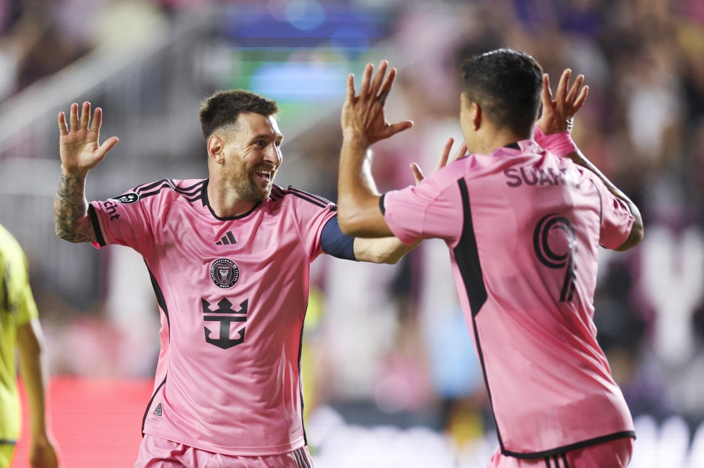Lionel Messi (10) celebrates after scoring a goal with forward Luis Suarez (9).— USA TODAY Sports

