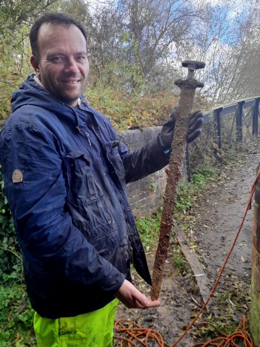 Trevor Penny with the Viking sword he found while magnet fishing in central England's River Cherwell. 