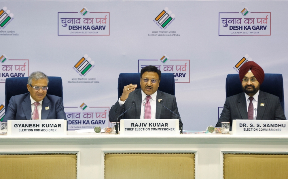 India's Chief Election Commissioner Rajiv Kumar speaks as Election Commissioners Gyanesh Kumar and S. S. Sandhu look on during a press conference in New Delhi. — Reuters 