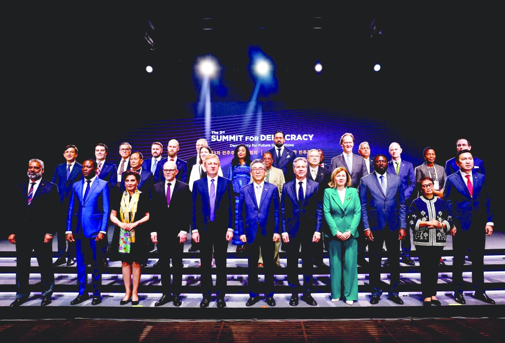 Summit leaders pose for a family photo during the Third Summit for Democracy in Seoul. — AFP 