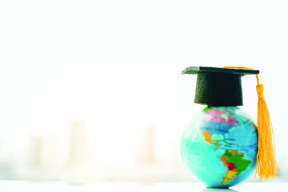 Graduated,Study,Abroad,International,back,To,School,Concept.,Graduation,Hat,On