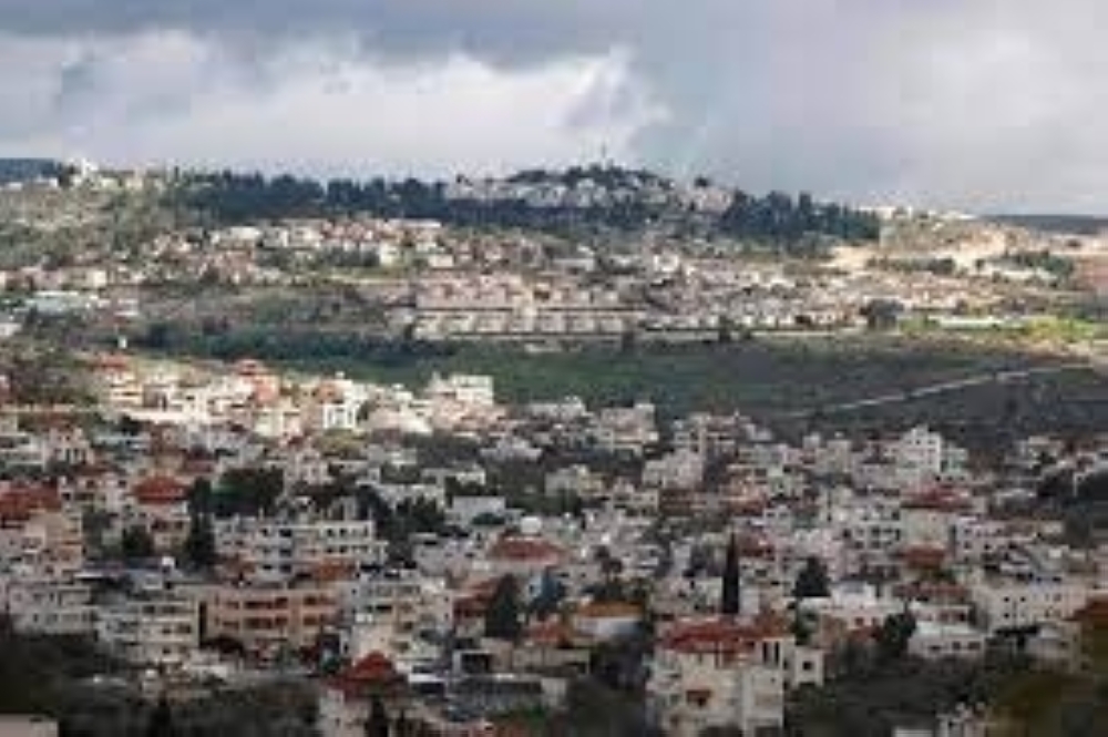 Picture shows the village of Turmus Ayya near Ramallah city and the nearby Israeli Shilo settlement in the background, in the occupied West Bank

Asharq Al Awsat