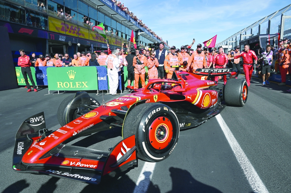 Carlos Sainz Jr enters the pits after winning the Australian Grand Prix.— REUTERS