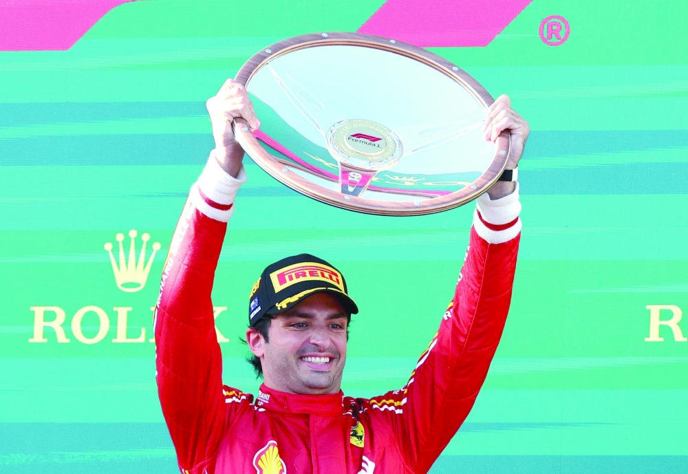 Carlos Sainz Jr celebrates with the trophy.—  REUTERS