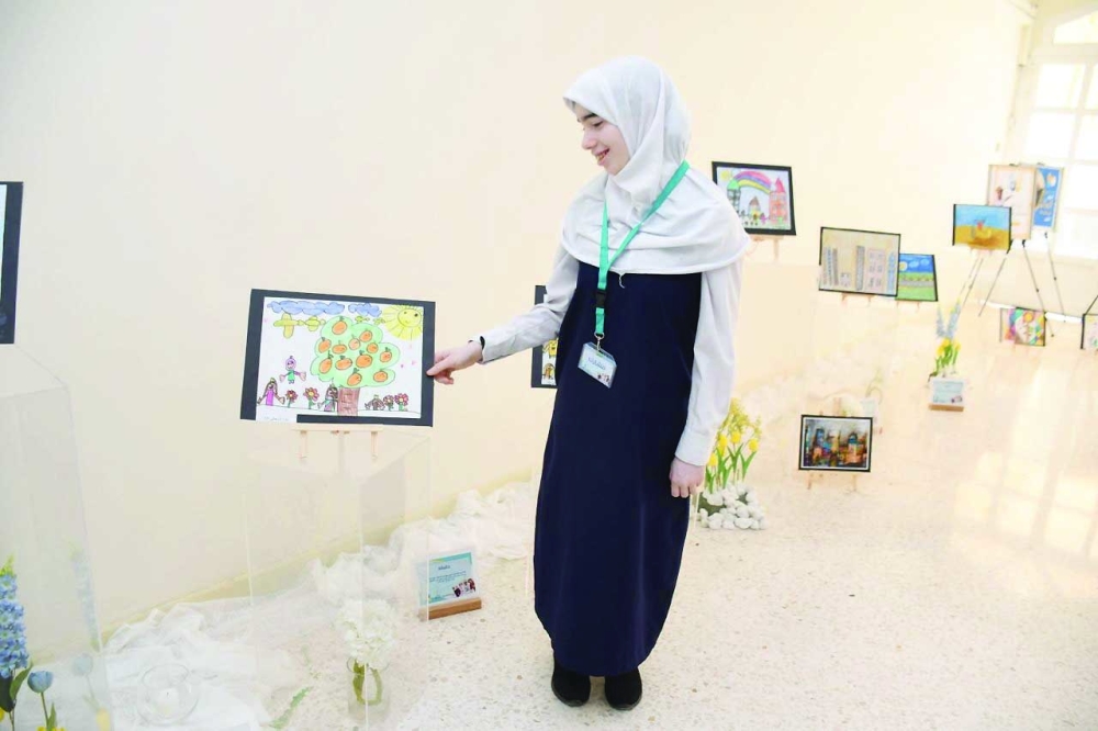 A student showcases artistic works of Down Syndrome
