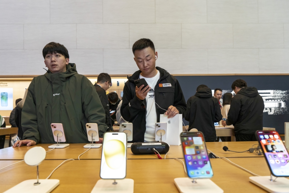 Customers at an Apple Store in Shanghai