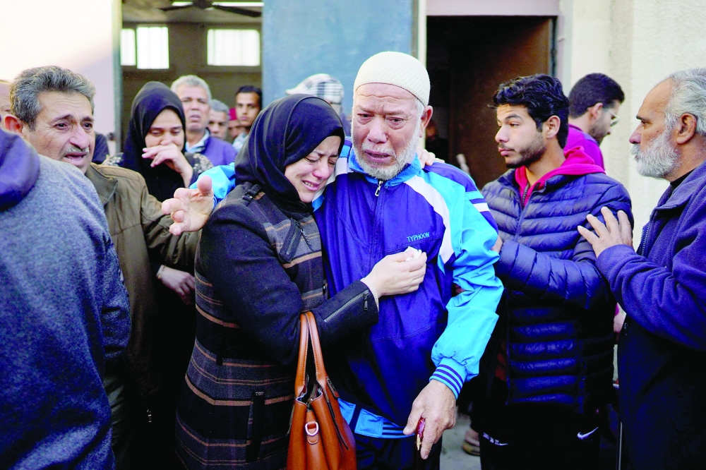 Palestinians mourn their relatives, killed in Israeli bombardment, at Al-Aqsa Martyrs Hospital in Deir al-Balah. — AFP 