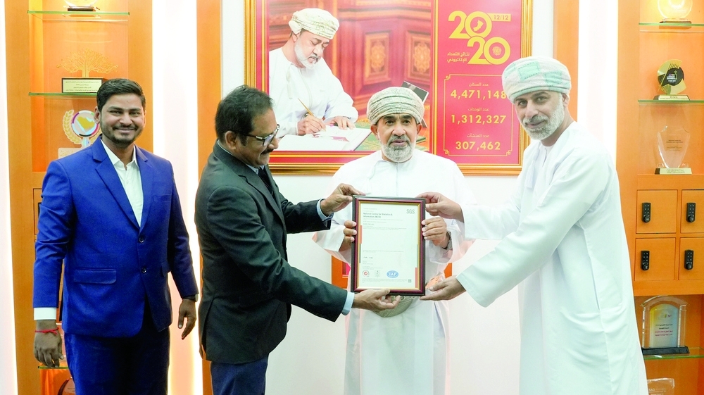 Khalifa bin Abdullah al Barwani, CEO of NCSI, receives the certificate