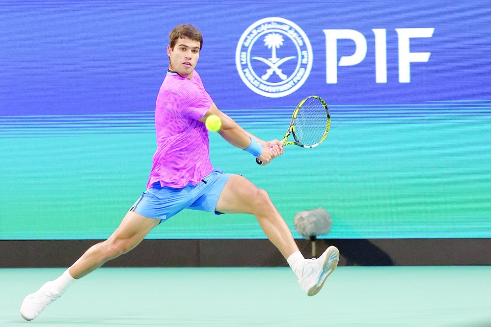 Mar 26, 2024; Miami Gardens, FL, USA; Carlos Alcaraz (ESP) hits a backhand against Lorenzo Musetti (ITA) (not pictured) on day nine of the Miami Open at Hard Rock Stadium. Mandatory Credit: Geoff Burke-USA TODAY Sports
