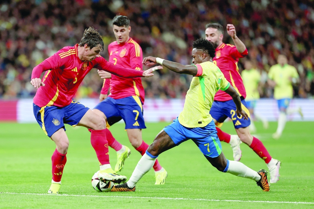 Brazil fight back to draw six-goal thriller with Spain
