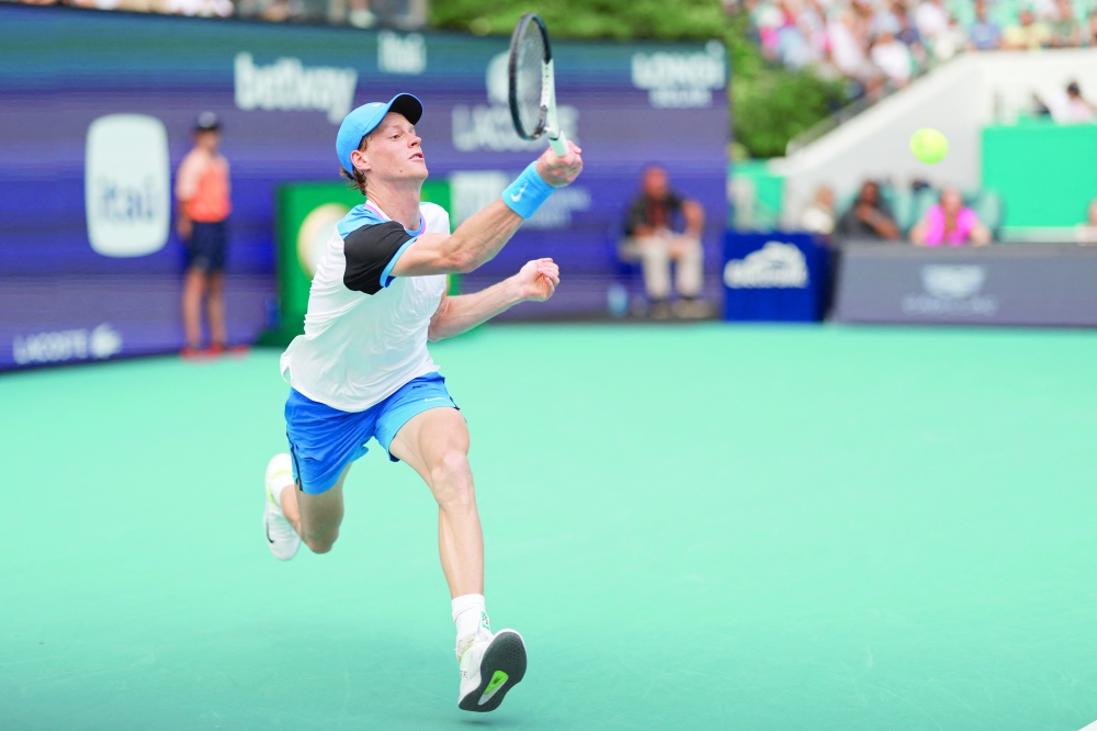 Jannik Sinner (ITA) hits a forehand against Tomas Machac (CZE) on day ten of the Miami Open at Hard Rock Stadium.
