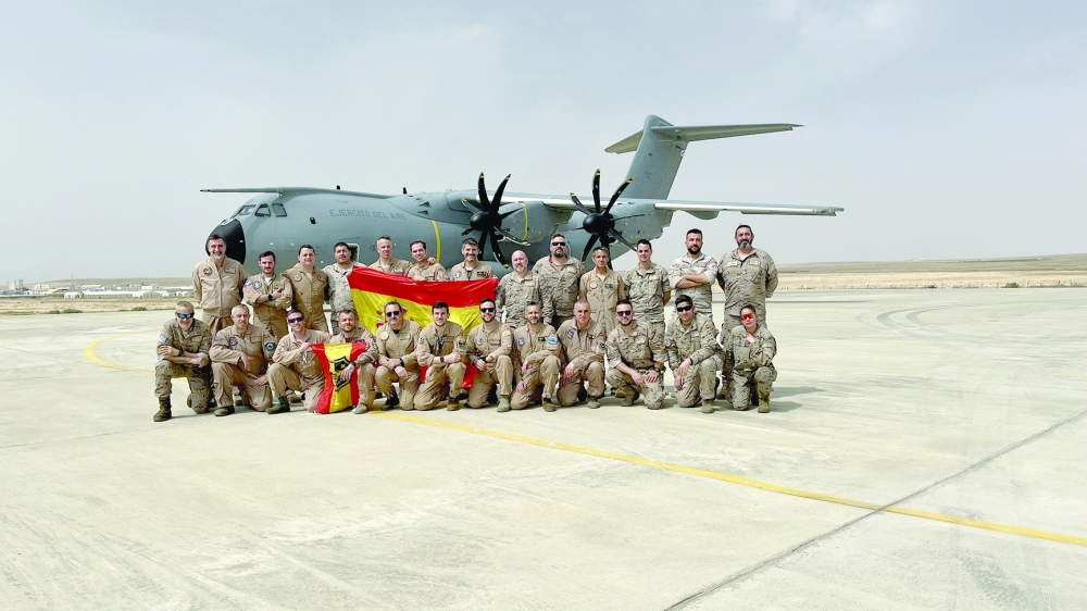 Spanish Air Force personnel pose for a picture ahead of a mission to deliver humanitarian aid to the Gaza Strip, in the Zaragoza Air Base, Spain. - Reuters