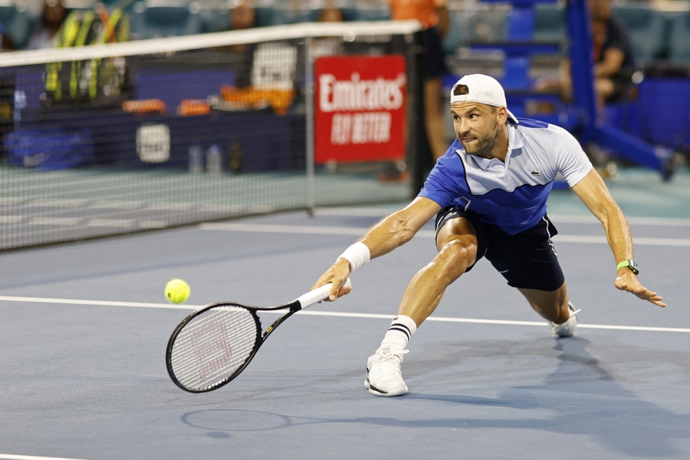 Mar 28, 2024; Miami Gardens, FL, USA; Grigor Dmitrov (BUL) reaches for a volley against Carlos Alcaraz (ESP) (not pictured) on day eleven of the Miami Open at Hard Rock Stadium. Mandatory Credit: Geoff Burke-USA TODAY Sports
